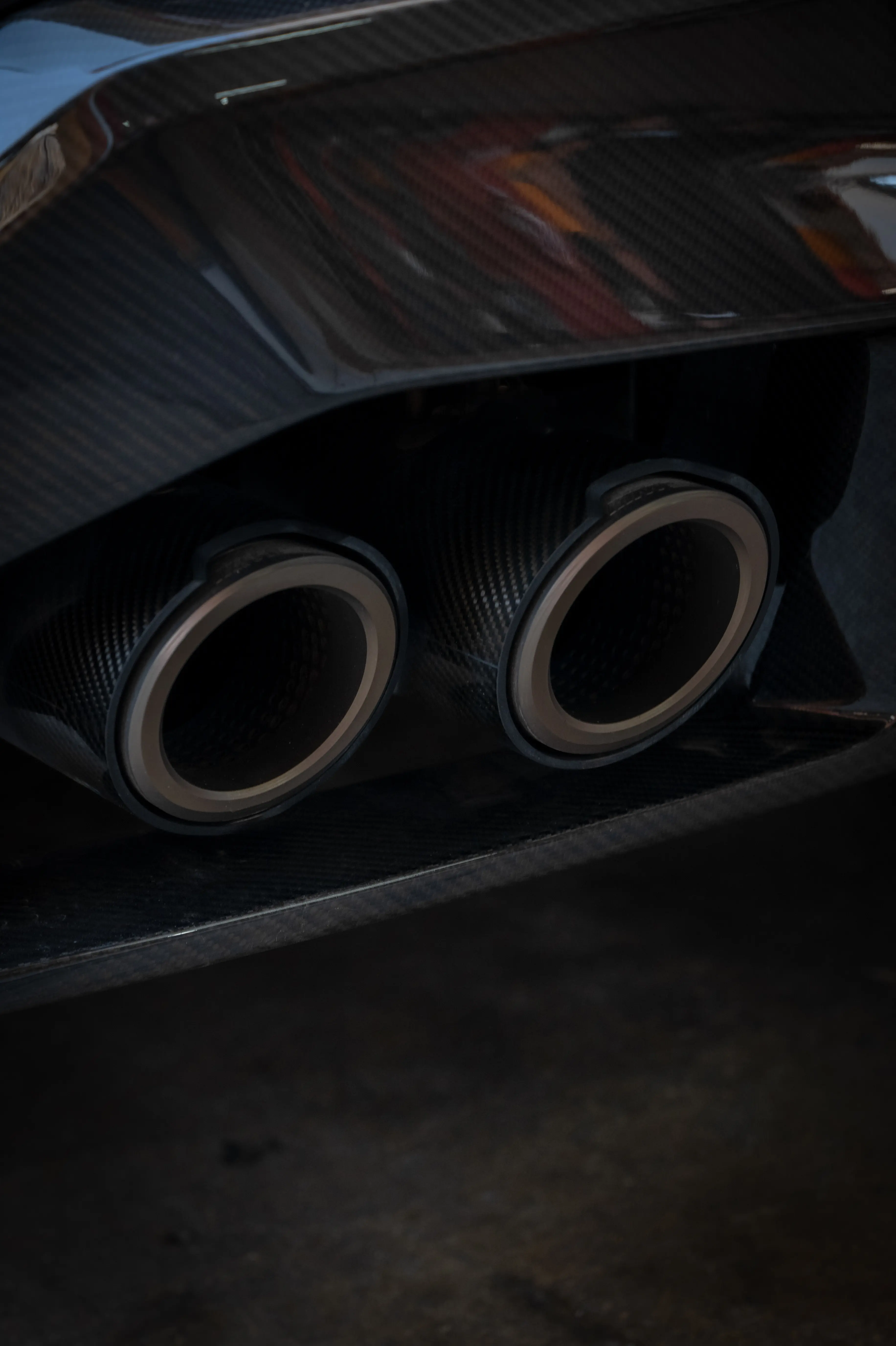 Close-up car exhaust pipe inspection detail